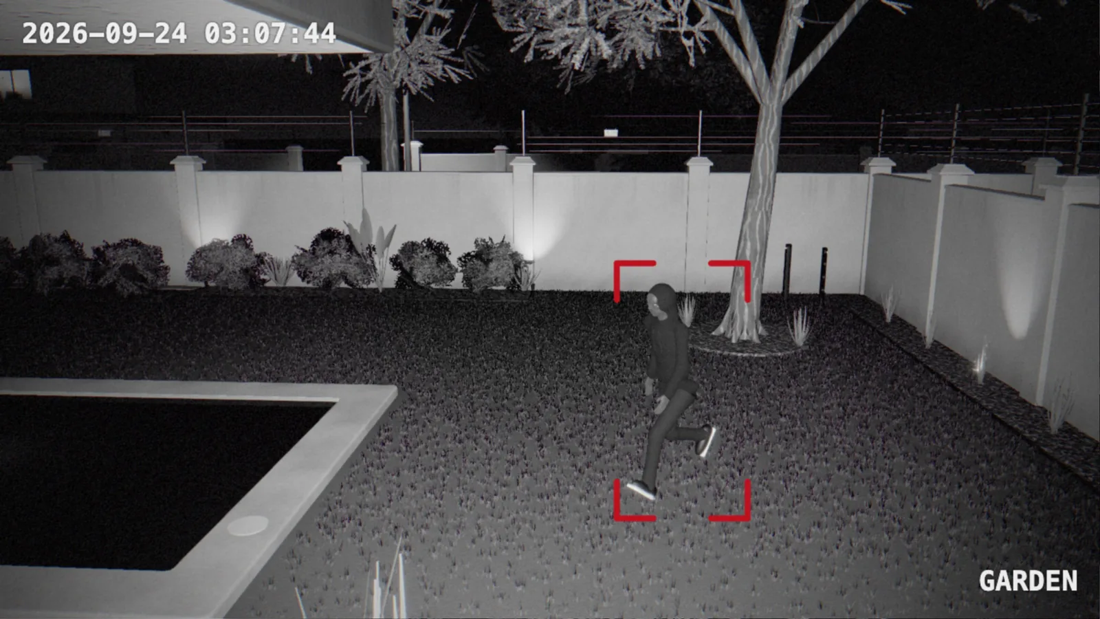 A second alarm photo of the same person further across the lawn