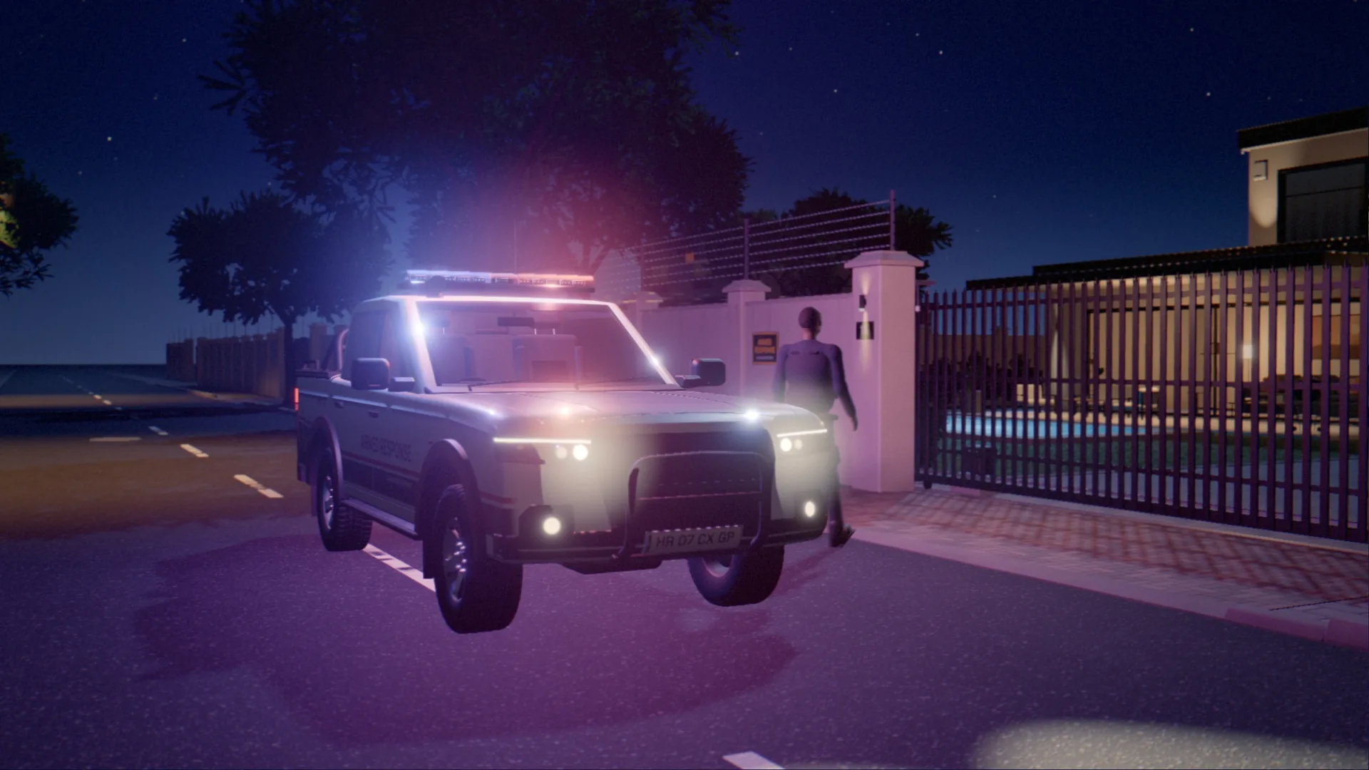 An armed response vehicle with its lights on, arriving at the gate of a house at night